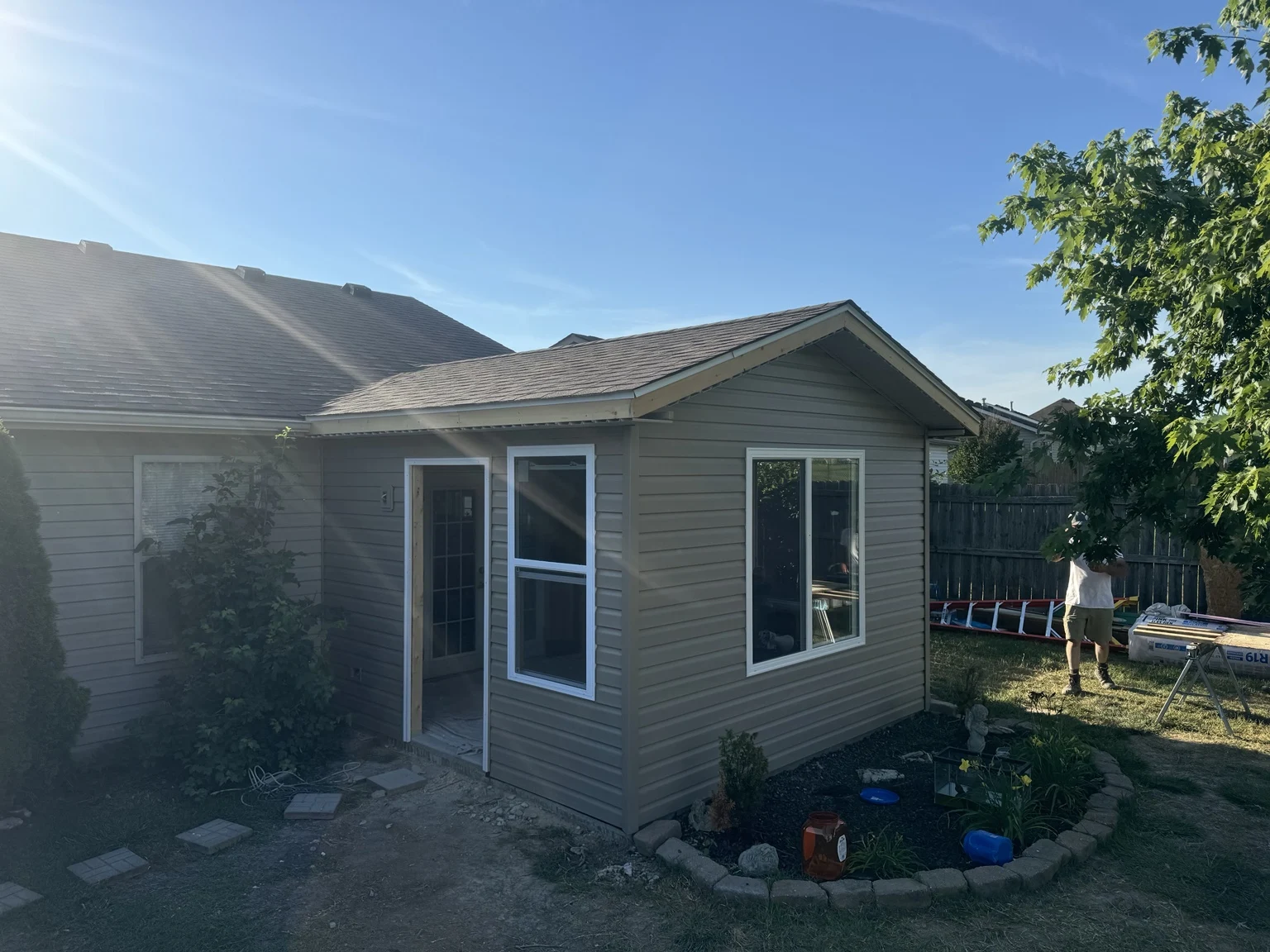 House addition with lap siding and tall windows