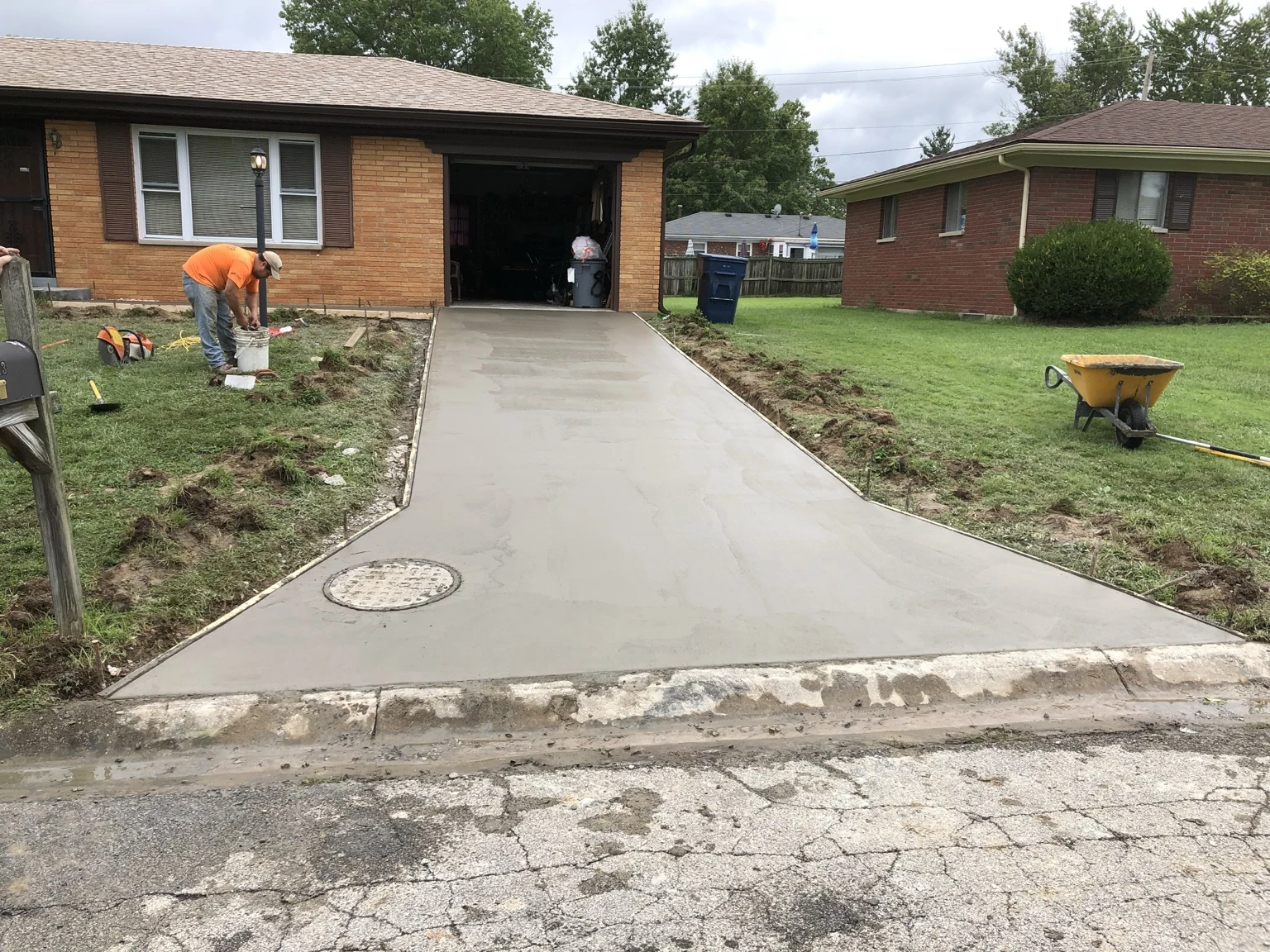 Freshly poured concrete driveway with forms still in place