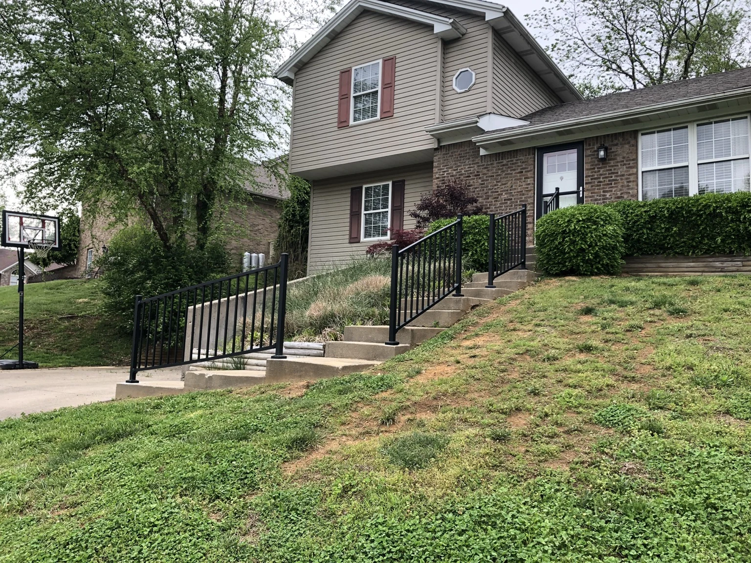 Black metal railings along a residential front stairway